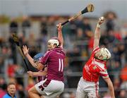 25 September 2011; Martin Scullion, Loughgiel Shamrocks, fields the ball ahead of Conor - 562571