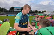 16 July 2016; Over 410 budding hurlers from Dublin lined out at the weekend in Parnell Park for the eight Centra hurling event of the season. The event, which was also attended by hurling stars Henry Shefflin, Liam Rushe and Austin Gleeson, is part of Centra’s Live Well initiative which promotes healthy living and encourages people to get active. For more information see www.centra.ie. Pictured is Centra ambassador and former Kilkenny hurler Henry Shefflin signing autographs. Photo by Piaras Ó Mídheach/Sportsfile