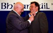 11 April 1997; Jack Boothman, left, the outgoing President of the GAA, places the medal on the lapel of Joe McDonagh, the newly elected president, at the GAA Congress, in the Burlington Hotel in Dublin. Photo by Ray McManus/Sportsfile