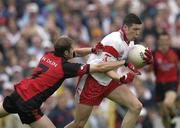 20 July 2003; Sean Cavanagh of Tyrone in action against Alan Molloy of Down during the Bank of Ireland Ulster GAA Football Senior Championship Final replay match between Down and Tyrone at St. Tighearnach's Park in Clones, Co Monaghan. Photo by Brendan Moran/Sportsfile