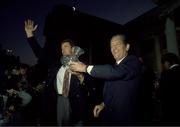 July 1 1990; Packie Bonner, Republic of Ireland goalkeeper, receives a presentation from Brian Lenihan TD, An Tanaiste, during their homecoming from World Cup Italy 1990 in Dublin. Photo by Ray McManus / SPORTSFILE