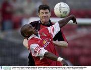 2 August 2003; Charles Livingstone Mbabazi of St Patrick's Athletic in action against Alan Murphy of Longford Town's during the eircom League Premier Division match between Longford Town and St Patrick's Athletic at Flancare Park, Longford. Photo by David Maher/Sportsfile
