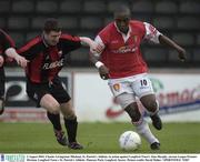 2 August 2003; Charles Livingstone Mbabazi of St Patrick's Athletic in action against Alan Murphy of Longford Town's during the eircom League Premier Division match between Longford Town and St Patrick's Athletic at Flancare Park, Longford. Photo by David Maher/Sportsfile