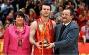 27 January 2018; Black Amber Templeogue captain Stephen James is presented with the cup by Theresa Walsh, President, Basketball Ireland and Patrick Baumann, Secretary General, FIBA, during the Hula Hoops Pat Duffy National Cup Final match between UCD Marian and Black Amber Templeogue at the National Basketball Arena in Tallaght, Dublin. Photo by Brendan Moran/Sportsfile