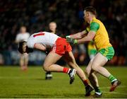 17 February 2018; Ronan McHugh of Tyrone in action against Eamonn Doherty of Donegal during the Bank of Ireland Dr. McKenna Cup Final match between Tyrone and Donegal at the Athletic Grounds in Armagh. Photo by Oliver McVeigh/Sportsfile