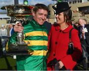 13 March 2018; Jockey Barry Geraghty with his wife Paula after winning the UniBet Champion Hurdle Challenge Trophy with Buveur D'air on Day One of the Cheltenham Racing Festival at Prestbury Park in Cheltenham, England. Photo by Ramsey Cardy/Sportsfile