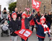 17 March 2018: Cuala supporters march to the Dart station during DAVY/ Cuala GAA pre-match activities ahead of the AIB GAA Hurling All-Ireland Senior Club Championship Final between Cuala and Na Piarsaigh. DAVY is proud to sponsor the Cuala Senior Hurling Team. The activities took place at Cuala GAA in Dalkey, Dublin. Photo by Sam Barnes/Sportsfile