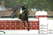 9 August 2003; Cian O'Connor of Ireland competes on Irish Independent Absolon in the Puissance Competition during day three of the Dublin Horse Show at the RDS in Dublin. Photo by Ray McManus/Sportsfile