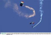 10 August 2003; Members of the Black Knights Parachute Display Team of the Irish Defence Forces decends into Santry Stadium during the Woodie's DIY National Senior Track and Field Championships at Morton Stadium in Santry, Dublin. Photo by Brendan Moran/Sportsfile