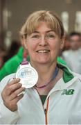 25 March 2018; Irish Masters team member Bríd Lawlor from St Joseph's AC, Co. Kilkenny, with her silver medal which she won in the Women's over 45 walk event, during European Masters Indoor Track & Field Championships in Madrid, at Dublin Airport in Dublin. Photo by Tomás Greally/Sportsfile