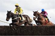 1 April 2018; Al Boum Photo, left, with David Mullins up, jumps the third alongside eventual second place Shattered Love, right, with Jack Kennedy up, during the first circuit on their way to winning the Ryanair Gold Cup Novice Steeplechase on Day 1 of the Fairyhouse Easter Festival at Fairyhouse Racecourse in Ratoath, Co Meath. Photo by Seb Daly/Sportsfile