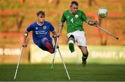 4 May 2018; Garry Hoey of Ireland in action against Jamie Tregaksiss of England during the Citywest Hotel EAFF Amputee Football Weeks Tournament match between Ireland and England at Dalymount Park in Dublin. Photo by Harry Murphy/Sportsfile