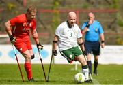 5 April 2018; Kevin Callihane of Ireland, right, in action against Marcin Kusinski of Poland during the Citywest Hotel EAFF Amputee Football Weeks Tournament match between Ireland and Poland at Dalymount Park in Dublin. Photo by Barry Cregg/Sportsfile