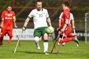 5 April 2018; Kevin O'Rourke, centre, of Ireland in action against Krystian Kaplon, of Poland during the Citywest Hotel EAFF Amputee Football Weeks Tournament match between Ireland and Poland at Dalymount Park in Dublin. Photo by Barry Cregg/Sportsfile