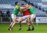 13 May 2018; Seán Murphy of Carlow in action against Ryan Burns and Eoghan Ruth of Carlow during the Leinster GAA Football Senior Championship Preliminary Round match between Louth and Carlow at O'Moore Park in Laois. Photo by Harry Murphy/Sportsfile