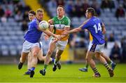 13 May 2018; Conor Carroll of Offaly in action against Dean Healy and John McGrath of Wicklow during the Leinster GAA Football Senior Championship Preliminary Round match between Offaly and Wicklow at O'Moore Park in Laois. Photo by Harry Murphy/Sportsfile