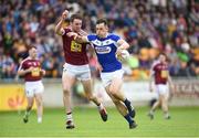 26 May 2018; John O'Loughlin of Laois  in action against Darragh Daly of Westmeath during the Leinster GAA Football Senior Championship Quarter-Final match between Laois and Westmeath at Bord na Mona O'Connor Park in Tullamore, Offaly. Photo by Matt Browne/Sportsfile