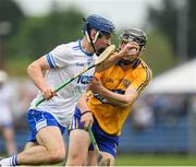 27 May 2018; James Power of Waterford n action against Darragh Healy of Clare during the Electric Ireland Munster GAA Hurling Minor Championship Round 2 match between Clare and Waterford at Cusack Park in Ennis, Co Clare. Photo by Ray McManus/Sportsfile