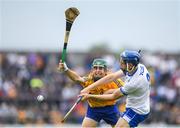 27 May 2018; Gavin Fives of Waterford clears under pressure against Conor Hegarty of Clare during the Electric Ireland Munster GAA Hurling Minor Championship Round 2 match between Clare and Waterford at Cusack Park in Ennis, Co Clare. Photo by Ray McManus/Sportsfile