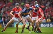 27 May 2018; Billy McCarthy of Tipperary in action against Mark Coleman, left and Sean O'Donoghue of Cork during the Munster GAA Hurling Senior Championship Round 2 match between Tipperary and Cork at Semple Stadium in Thurles, Tipperary. Photo by Eóin Noonan/Sportsfile