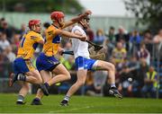 27 May 2018; Waterford full back Barry Coughlan kicks the sliorhar out for a '65', under pressure from Peter Duggan and John Conlon of Clare, 11, during the Munster GAA Hurling Senior Championship Round 2 match between Clare and Waterford at Cusack Park in Ennis, Co Clare. Photo by Ray McManus/Sportsfile