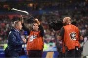 28 May 2018; RTE's Tony O'Donoghue is sheltered from the rain during a broadcast prior to the International Friendly match between France and Republic of Ireland at Stade de France in Paris, France. Photo by Stephen McCarthy/Sportsfile