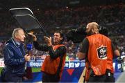 28 May 2018; RTE's Tony O'Donoghue is sheltered from the rain during a broadcast prior to the International Friendly match between France and Republic of Ireland at Stade de France in Paris, France. Photo by Stephen McCarthy/Sportsfile