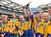 5 June 2018; Captain of St. Clare's PS, Harold's Cross, Dublin, Ella Crotty lifts the shield following her side's victory against Holy Rosary PS, Ballycragh, Co. Dublin in the Corn Olly Quinlan Shield final during Day 1 of the Allianz Cumann na mBunscol finals at Croke Park, in Dublin. Photo by Seb Daly/Sportsfile