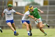 10 June 2018; Colin Coughlan of Limerick is tackled by Rory Furlong of Waterford during the Electric Ireland Munster GAA Hurling Minor Championship match between Limerick and Waterford at the Gaelic Grounds in Limerick. Photo by Ramsey Cardy/Sportsfile