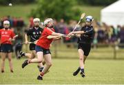 10 June 2018; Evie Twomey of Sarsfields, Co Cork, in action against Sarah Cogley of Carnmore, Co Galway, during the Division 1 Camogie semi-final between Carnmore, Co Galway and Sarsfields, Co Cork, at the John West Féile na nGael national competition which took place this weekend across Connacht, Westmeath and Longford. This is the third year that the Féile na nGael and Féile Peile na nÓg have been sponsored by John West, one of the world’s leading suppliers of fish. The competition gives up-and-coming GAA superstars the chance to participate and play in their respective Féile tournament, at a level which suits their age, skills and strengths. Photo by Matt Browne/Sportsfile