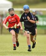 10 June 2018; Caoimhe Galvin of Sarsfields, Co Cork, in action against Ava Killian of Carnmore, Co Galway, during the Division 1 Camogie semi-final between Carnmore, Co Galway and Sarsfields, Co Cork, at the John West Féile na nGael national competition which took place this weekend across Connacht, Westmeath and Longford. This is the third year that the Féile na nGael and Féile Peile na nÓg have been sponsored by John West, one of the world’s leading suppliers of fish. The competition gives up-and-coming GAA superstars the chance to participate and play in their respective Féile tournament, at a level which suits their age, skills and strengths. Photo by Matt Browne/Sportsfile