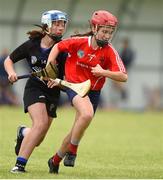 10 June 2018; Aoife Collins of Carnmore, Co Galway, in action against Ella O'Brien of Sarsfields, Co Cork, during the Division 1 Camogie semi-final between Carnmore, Co Galway and Sarsfields, Co Cork, at the John West Féile na nGael national competition which took place this weekend across Connacht, Westmeath and Longford. This is the third year that the Féile na nGael and Féile Peile na nÓg have been sponsored by John West, one of the world’s leading suppliers of fish. The competition gives up-and-coming GAA superstars the chance to participate and play in their respective Féile tournament, at a level which suits their age, skills and strengths. Photo by Matt Browne/Sportsfile