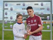 20 June 2018; Evan Niland of Galway is presented with the Bord Gáis Energy Man of the Match by Sean Fahy, aged 10, from Carnmore, Co. Galway, following the Bord Gáis Energy Leinster GAA Hurling U21 Championship Semi-Final match between Kilkenny and Galway. Bord Gáis Energy offers its customers unmissable rewards throughout the Championship season, including match tickets and hospitality, access to training camps with Hurling stars and the opportunity to present Man of the Match Awards at U-21 games. Bord Na Mona O'Connor Park, Tullamore, Co Offaly. Photo by Harry Murphy/Sportsfile