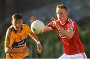 22 June 2018; Damien Gore of Cork in action against Jack Sheedy of Clare during the EirGrid Munster GAA Football U20 Championship semi-final match between Cork and Clare at Páirc Uí Rinn in Cork. Photo by Piaras Ó Mídheach/Sportsfile