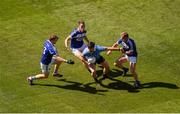 24 June 2018; Michael Darragh MacAuley of Dublin in action against Laois players, left to right, Mark Timmons, John O'Loughlin, and Damien O'Connor during the Leinster GAA Football Senior Championship Final match between Dublin and Laois at Croke Park in Dublin. Photo by Daire Brennan/Sportsfile