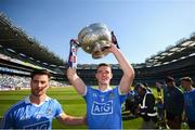 24 June 2018; Dublin's Brian Fenton and Michael Darragh Macauley, left, celebrate with the Delaney Cup following the Leinster GAA Football Senior Championship Final match between Dublin and Laois at Croke Park in Dublin. Photo by Stephen McCarthy/Sportsfile