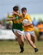 1 July 2018; Eoghan McAlinden of Clonduff GAC in action against Jack Buckley of Claregalway during the John West Féile Peil na nÓg National Competitions 2018 match between Claregalway and Clonduff GAC at Stamullen GAA in Meath. This is the third year that the Féile na nGael and Féile Peile na nÓg have been sponsored by John West, one of the world’s leading suppliers of fish. The competition gives up-and-coming GAA superstars the chance to participate and play in their respective Féile tournament, at a level which suits their age, skills and strengths. Photo by Harry Murphy/Sportsfile