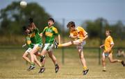 1 July 2018; Senan Carr of Clondduff GAC kicks a point under pressure from Ryan Kearney of Claregalway during the John West Féile Peil na nÓg National Competitions 2018 match between Claregalway and Clonduff GAC at Stamullen GAA in Meath. This is the third year that the Féile na nGael and Féile Peile na nÓg have been sponsored by John West, one of the world’s leading suppliers of fish. The competition gives up-and-coming GAA superstars the chance to participate and play in their respective Féile tournament, at a level which suits their age, skills and strengths. Photo by Harry Murphy/Sportsfile