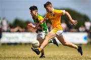 1 July 2018; Eoghan McAlinden of Clonduff GAC in action against Jack Ramsay of Claregalway during the John West Féile Peil na nÓg National Competitions 2018 match between Claregalway and Clonduff GAC at Stamullen GAA in Meath. This is the third year that the Féile na nGael and Féile Peile na nÓg have been sponsored by John West, one of the world’s leading suppliers of fish. The competition gives up-and-coming GAA superstars the chance to participate and play in their respective Féile tournament, at a level which suits their age, skills and strengths. Photo by Harry Murphy/Sportsfile