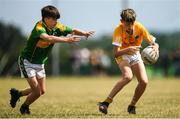 1 July 2018; Callum Donnan of Clonduff GAC in action against Jake Buckley of Claregalway during the John West Féile Peil na nÓg National Competitions 2018 match between Claregalway and Clonduff GAC at Stamullen GAA in Meath. This is the third year that the Féile na nGael and Féile Peile na nÓg have been sponsored by John West, one of the world’s leading suppliers of fish. The competition gives up-and-coming GAA superstars the chance to participate and play in their respective Féile tournament, at a level which suits their age, skills and strengths. Photo by Harry Murphy/Sportsfile