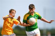 1 July 2018; Tom Nolan of Claregalway in action against Daniel McPolin of Clonduff GAC during the John West Féile Peil na nÓg National Competitions 2018 match between Claregalway and Clonduff GAC at Stamullen GAA in Meath. This is the third year that the Féile na nGael and Féile Peile na nÓg have been sponsored by John West, one of the world’s leading suppliers of fish. The competition gives up-and-coming GAA superstars the chance to participate and play in their respective Féile tournament, at a level which suits their age, skills and strengths. Photo by Harry Murphy/Sportsfile