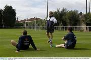 18 August 2003; Republic of Ireland players, from left,  Matt Holland, Damien Duff and Andy O'Brien, sit out training. Republic of Ireland soccer training at Tolka Rovers FC in Griffith Avenue, Dublin. Photo by Damien Eagers/Sportsfile