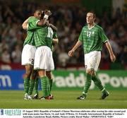 19 August 2003; Clinton Morrison of Republic of Ireland celebrates after scoring his sides second goal with teammates Ian Harte, centre, and Andy O'Brien, right, during an International Friendly between Republic of Ireland and Australia at Lansdowne Road, Dublin. Photo by David Maher/Sportsfile