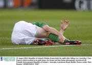 19 August 2003; Robbie Keane of Republic of Ireland holds his ankle after falling over Tony Popovic of Australia, which resulted in an ankle injury for Keane and him being subsequently stretchered off during an International Friendly between Republic of Ireland and Australia at Lansdowne Road, Dublin. Photo by Matt Browne/Sportsfile