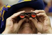 17 August 2003; A Tipperary fan watches the game through a pair of binoculars during the Guinness All-Ireland Senior Hurling Championship Semi-Final between Kilkenny and Tipperary at Croke Park in Dublin. Photo by Brendan Moran/Sportsfile