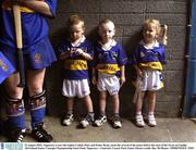 23 August 2003; Tipperary 4 year old triplets Cathal, Peter and Eimer Ryan, await the arrival of the teams before the start of the Foras na Gaeilge All-Ireland Senior Camogie Championship Semi-Final between Tipperary and Limerick at Cusack Park, Ennis. Photo by Ray McManus/Sportsfile