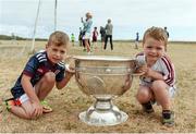 10 July 2018; Brothers Eoghan Quinn, aged 6, left, and Cathal Quinn, aged 3, with the Sam Maguire cup during a visit to Aran Islands GAA club prior to the GAA Hurling and Football All Ireland Senior Championship Series National Launch at the Aran Islands, Co Galway. Photo by Diarmuid Greene/Sportsfile