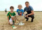 10 July 2018; Michael Fitzsimons of Dublin with Cillian O'Moran, aged 8, and Eoghan Ó Moran, aged 2, and the Sam Maguire cup during a visit to Aran Islands GAA club prior to the GAA Hurling and Football All Ireland Senior Championship Series National Launch at the Aran Islands, Co Galway.   Photo by Diarmuid Greene/Sportsfile