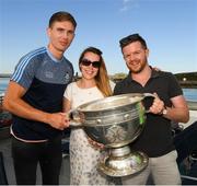 10 July 2018; Colm Burke, from Celbridge, Co Kildare, and his girlfriend Justina Mucya, from Poland, to whom Colm proposed during a visit to the Aran Islands, with Michael Fitzsimons of Dublin and the Sam Maguire Cup before the GAA Hurling and Football All Ireland Senior Championship Series National Launch at Dun Aengus in the Aran Islands, Co Galway. Photo by Ray McManus/Sportsfile