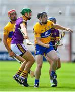14 July 2018; Tony Kelly of Clare in action against Matthew O'Hanlon and Kevin Foley of Wexford during the GAA Hurling All-Ireland Senior Championship Quarter-Final match between Clare and Wexford at Páirc Ui Chaoimh in Cork. Photo by Brendan Moran/Sportsfile